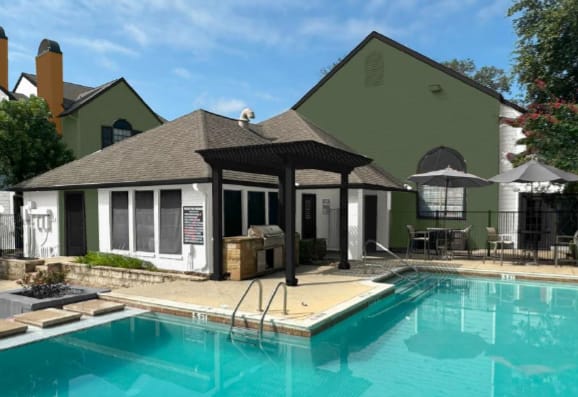 A pool with a pavilion in front of a house.