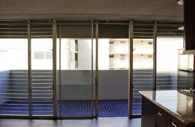 Waikiki Walina Apartments glass windows and doors to the balcony