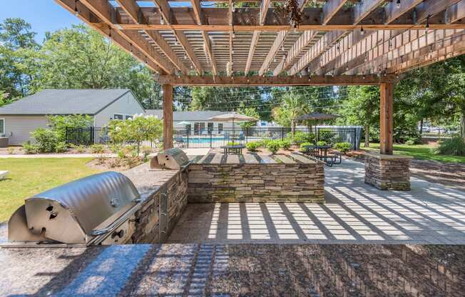 take advantage of the shady surroundings under the pergola at the whispering winds apartments in pear