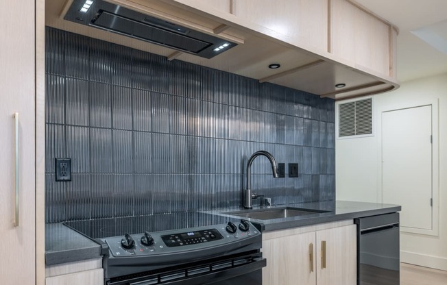 a kitchen with a sink and a stove in a house