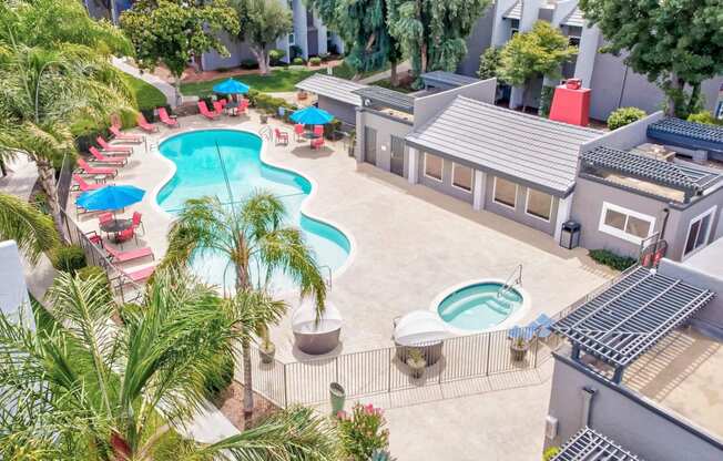 an aerial view of a pool and a resort style swimming pool