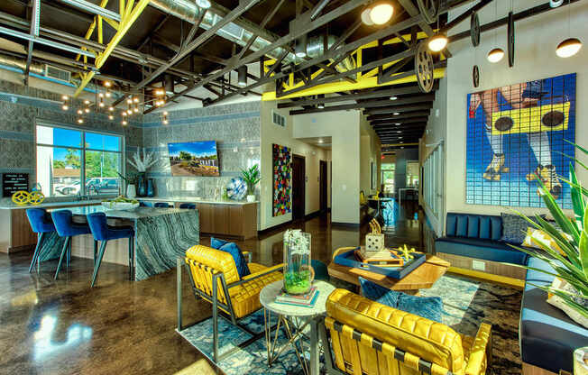 A room with a yellow chair and a blue chair.