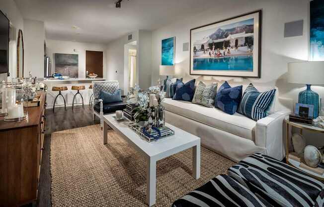 A living room with a white couch and a coffee table.
