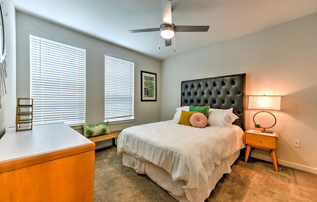 a bedroom with a bed and two windows  at Fusion, Jacksonville, FL, 32256