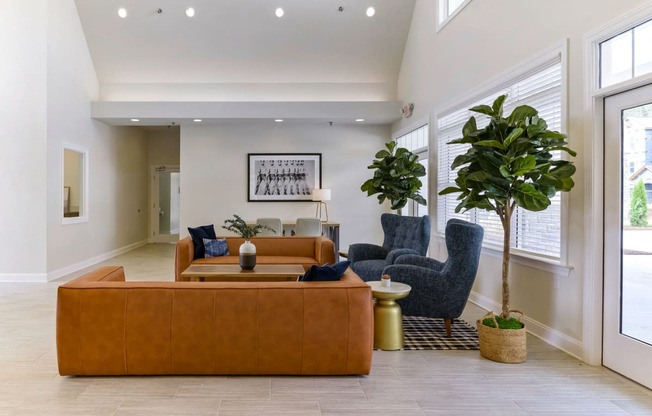 Ashland Farms Resident Clubhouse with Couch Seating, Modern Decor, and View of Pool Area