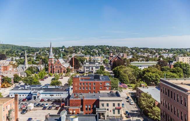 arial view of a small town with a church in the background