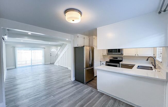 BEAUTIFUL 2 STORY TOWNHOUSE STYLE WITH A/C,  WASHER/DRYER, POOL, AND ONE PARKING SPACE