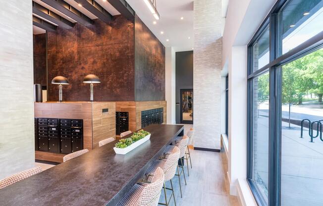 Coffee, comfort, and a curated mailroom—all in one chic lobby.