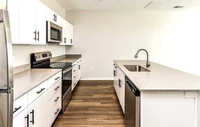 Studio, one two and three bedroom apartments and townhomes featuring open concept floor plans, dens, large windows, stainless steel appliances, quartz countertops, eat-in kitchens, pantries, LVT flooring and much more at The Trails at North Streams in Omaha, NE