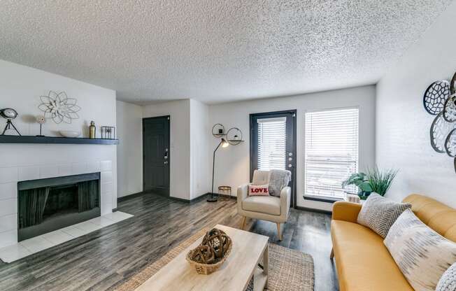 a living room with a fireplace and a couch