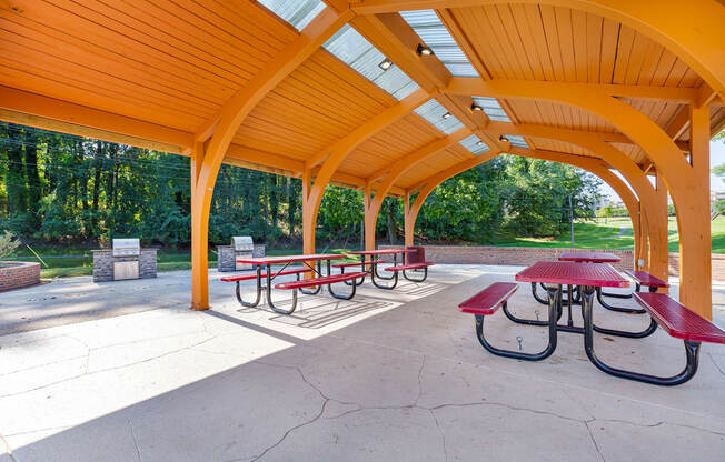 a covered picnic area with benches and tables at Copper and Quarry Village, Maryland, 21209