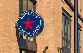 A sign on a building that says Borealis North Loo.