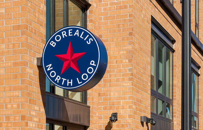 A sign on a building that says Borealis North Loo.