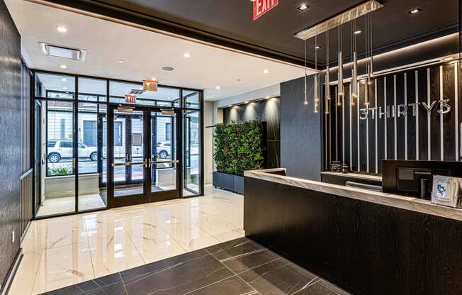 3thirty3 new rochelle ny apartment high rise photo of main entrance lobby with concierge desk and modern finishes