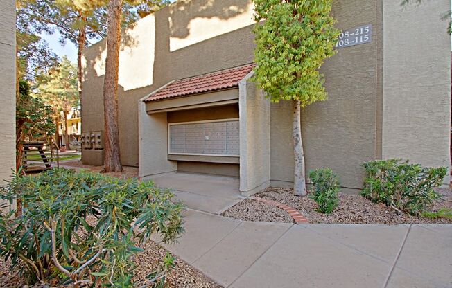 a garage with a tree in front of it