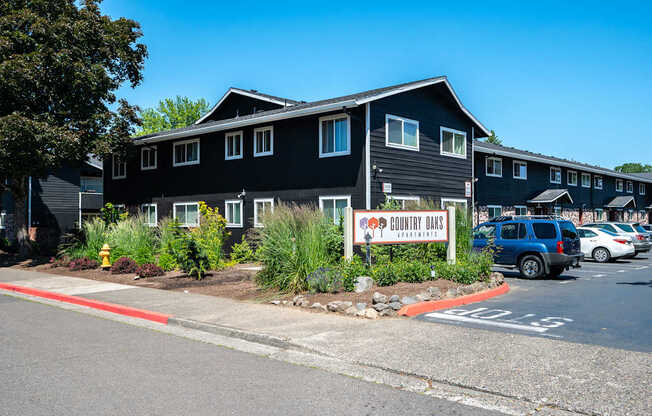 A black building with a sign that says