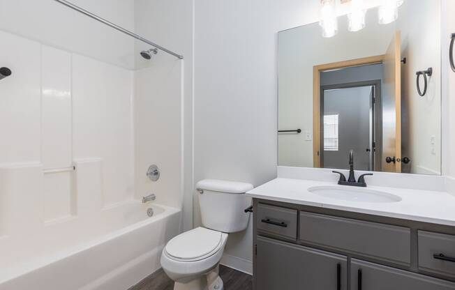 a bathroom with a sink toilet and a bath tub  at Shoreline Village, Richland, WA, 99352