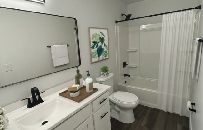 a bathroom with a white sink and toilet and a shower