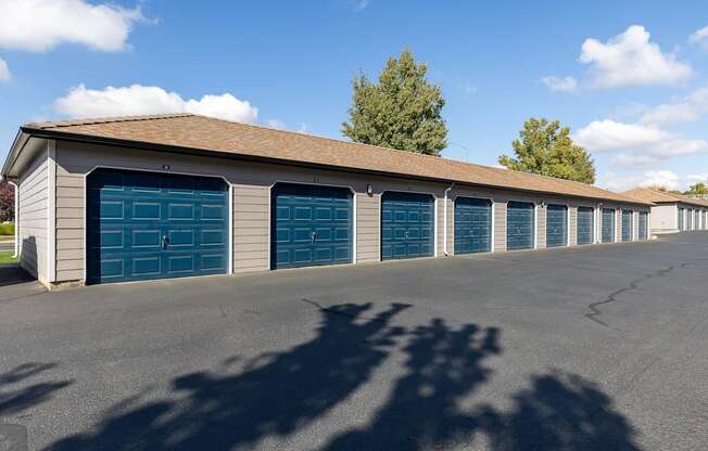 a long row of garages with blue garage doors  at Shoreline Village, Richland, WA, 99352