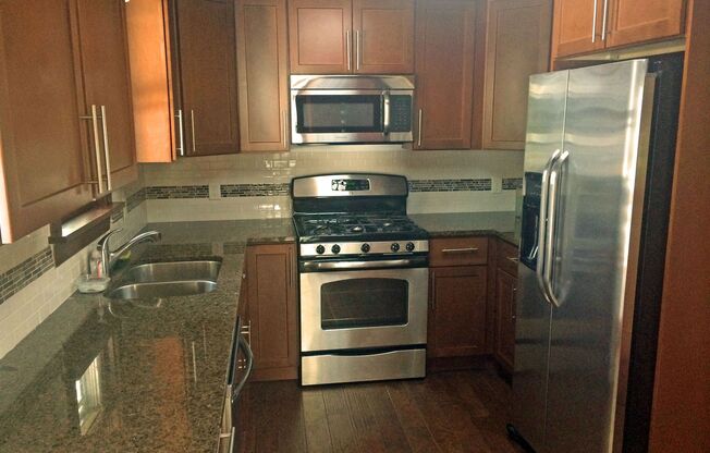 SINGLE FAMILY HOME! Great Location! Laundry, Wood Floors and Parking!
