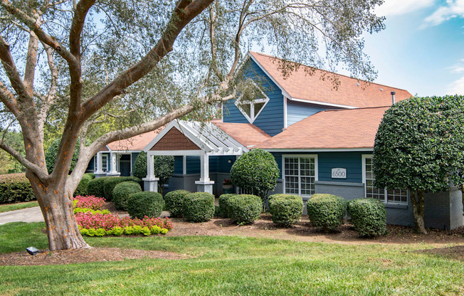 a house with a large tree in front of it