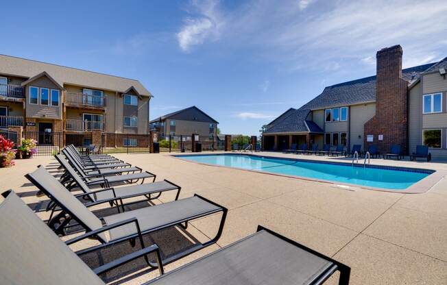 A sparkling pool with crystal-clear water beckons residents to enjoy a refreshing swim at the clubhouse.