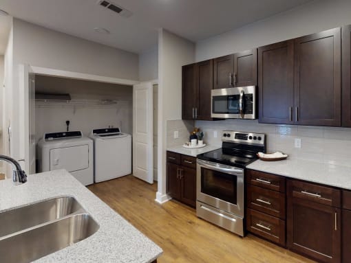 a kitchen with a stove and a sink