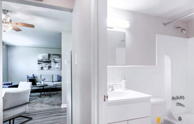 a bathroom with a bathtub and a sink