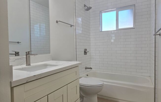 Renovated and Remodeled, New Driveway, New Yard, Kitchen and Bathrooms, Fresh Paint, Wood Floors!