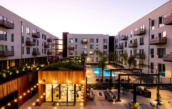 A courtyard with a pool surrounded by apartment buildings.