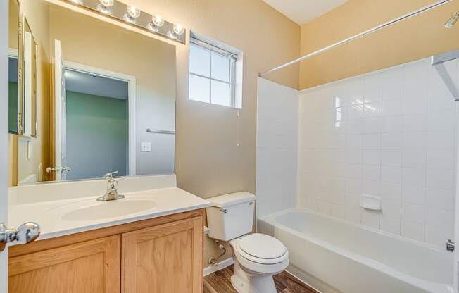 a bathroom with a sink toilet and a tub