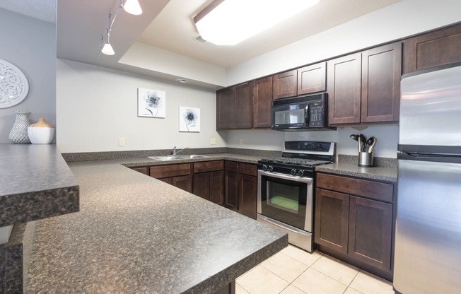Clubhouse Kitchen with stainless steel appliances at Brairwood Apartments in Columbus, IN