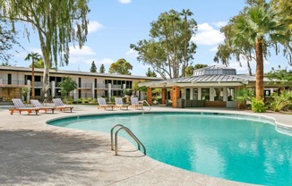 Pet-Friendly Apartments in Tempe – Sentry Tempe – a swimming pool in front of a community buildings