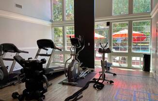 Campbell Plaza Apartments
710 Nido Drive, Campbell, CA 95008. A gym room with a variety of equipment including a treadmill, stationary bike, and weights.