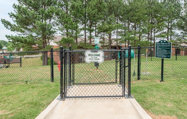 a dog park with a dog kennel and a sign that says hello kitty