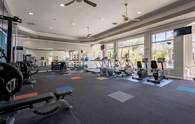 A spacious gym with a variety of exercise equipment.at Palazzo Townhomes, Arizona