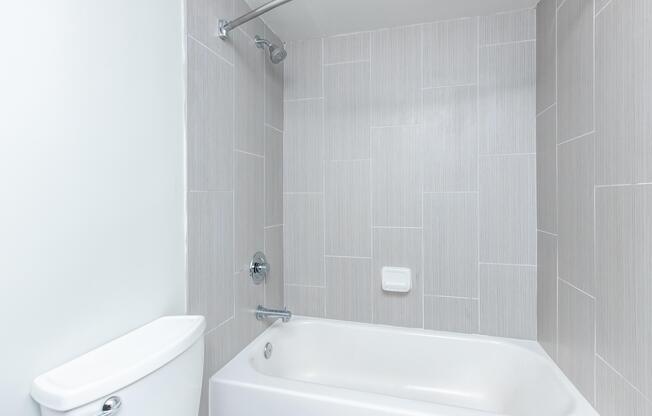 a room with a sink and a shower