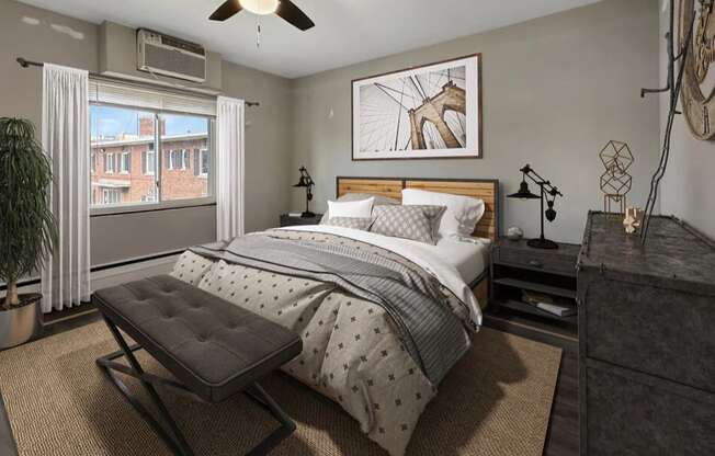 a bedroom with a bed and a ceiling fan
