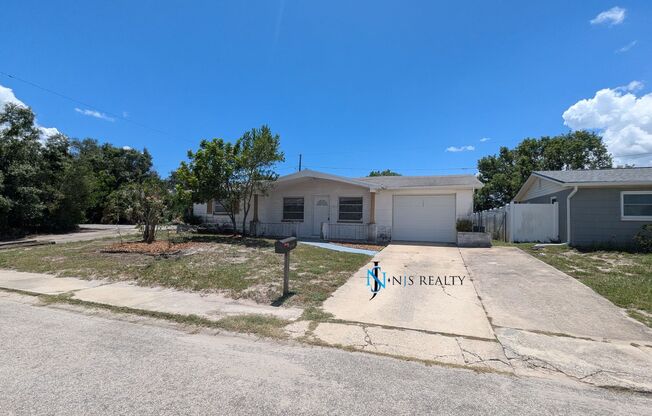 Must See 3/2/1 over 1000sf with tile/laminate floors, fresh paint, fenced yard and large living room!!