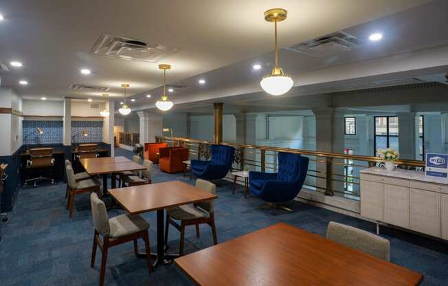 a dining room with tables and chairs and a bar at The Commonwealth Building, Pittsburgh, 15222