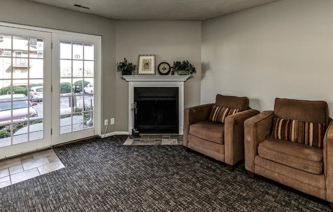 a living room with two couches and a fireplace