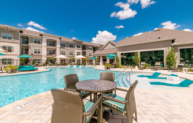 Poolside Dining Table at Cue Luxury Apartments, Cypress, TX, 77433