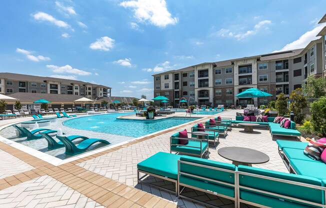 Salt-water swimming pool with sundeck and cabanas at Cyan Craig Ranch apartments for rent