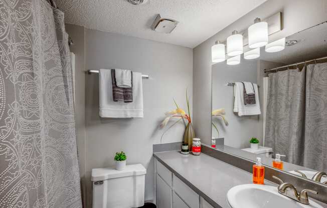 Upgraded bathroom with tub/shower and light colored vanity at The Waverly, Michigan, 48111