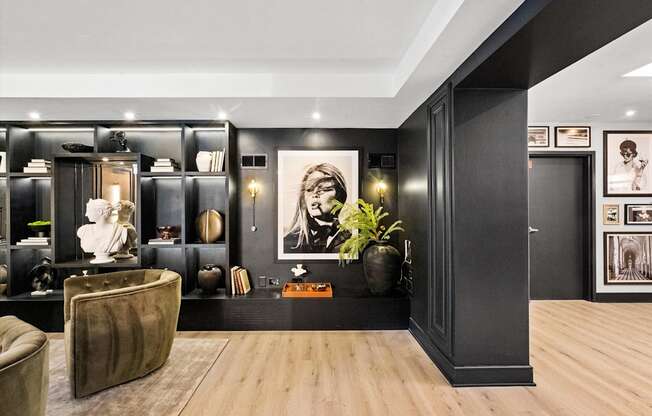 A modern living room with a brown leather chair and a wooden floor.