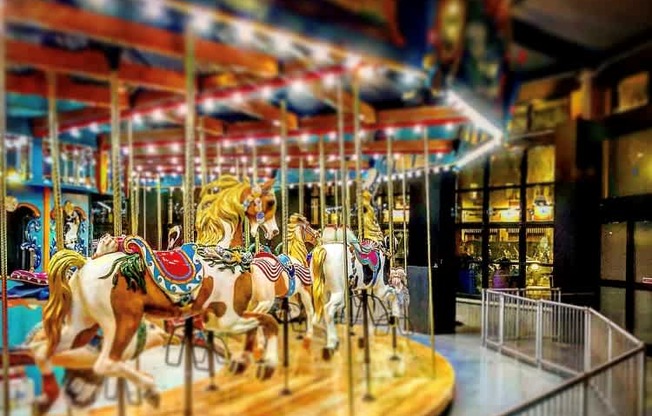A carousel with horses as the main attraction.