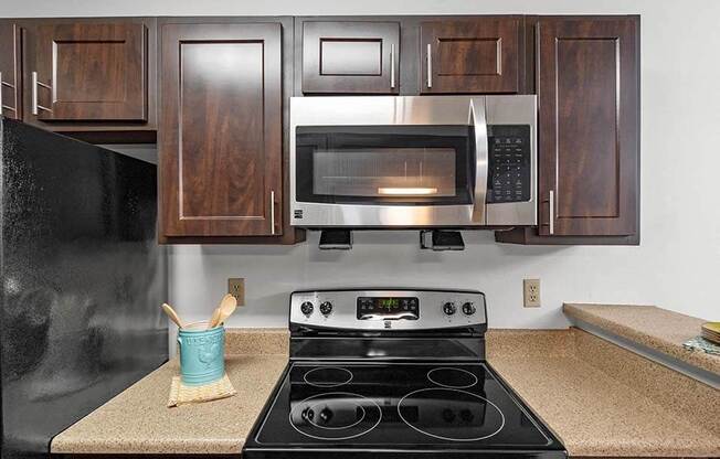 a kitchen with a stove and a microwave