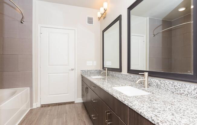 a kitchen with a sink and a mirror