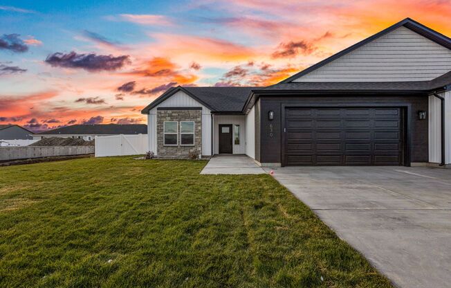 DARLING twin home located in Sugar City, Idaho 3 Bed 2 full baths with attached XL-GARAGE and FENCED YARD