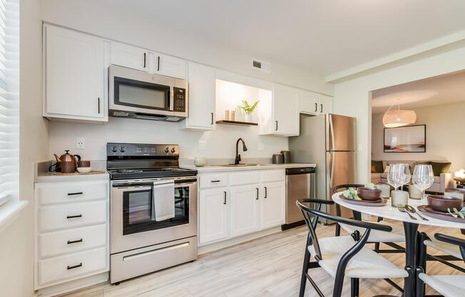 Platinum kitchen interior with white oak cabinets at The Arbor in Blue Springs, MO